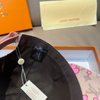 Louis Vuitton baseball cap in black with pink floral lining and logo tag