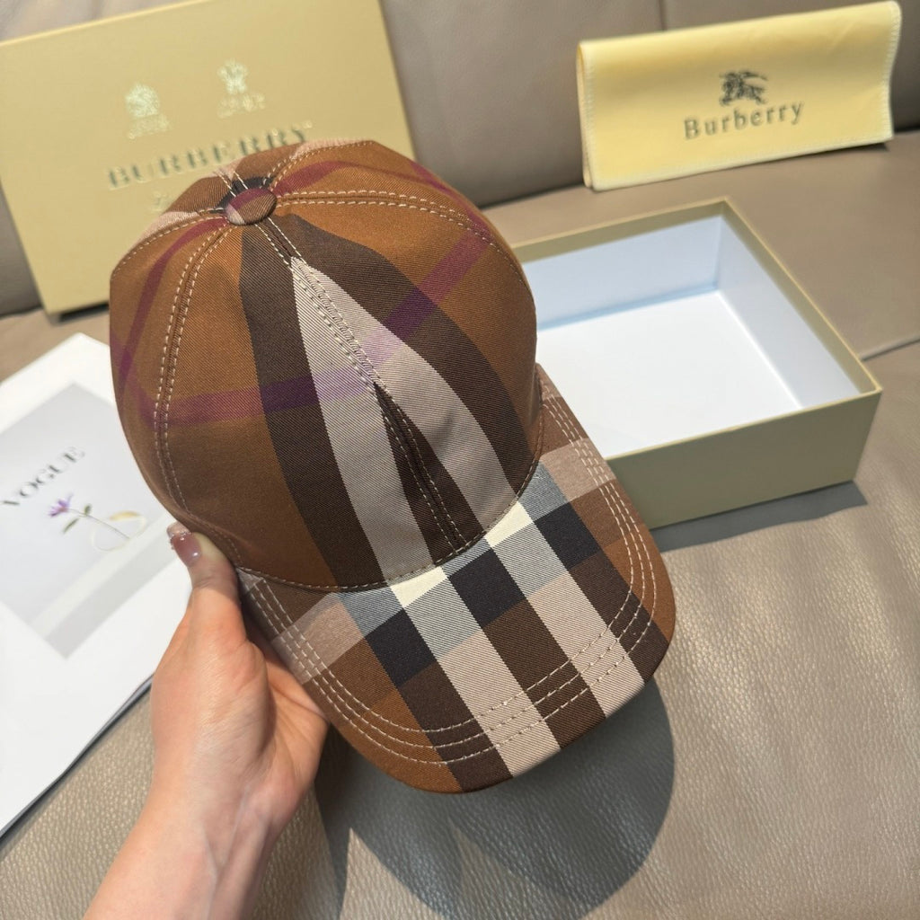 Brown plaid baseball cap with top button and curved brim.