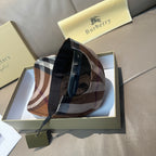 Plaid baseball cap with black strap and inner panel visible.