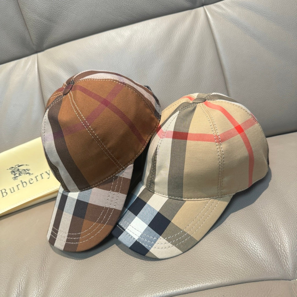 Pair of plaid baseball caps with beige, red, black, and white check pattern on brims