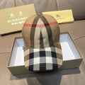 Plaid baseball cap in beige, red, black, and white with curved brim and stitched crown