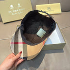 Plaid baseball cap showing dark interior lining and adjustable strap, beige and check pattern