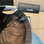 Denim cap with black mesh panel and CHANEL label detail, curved brim