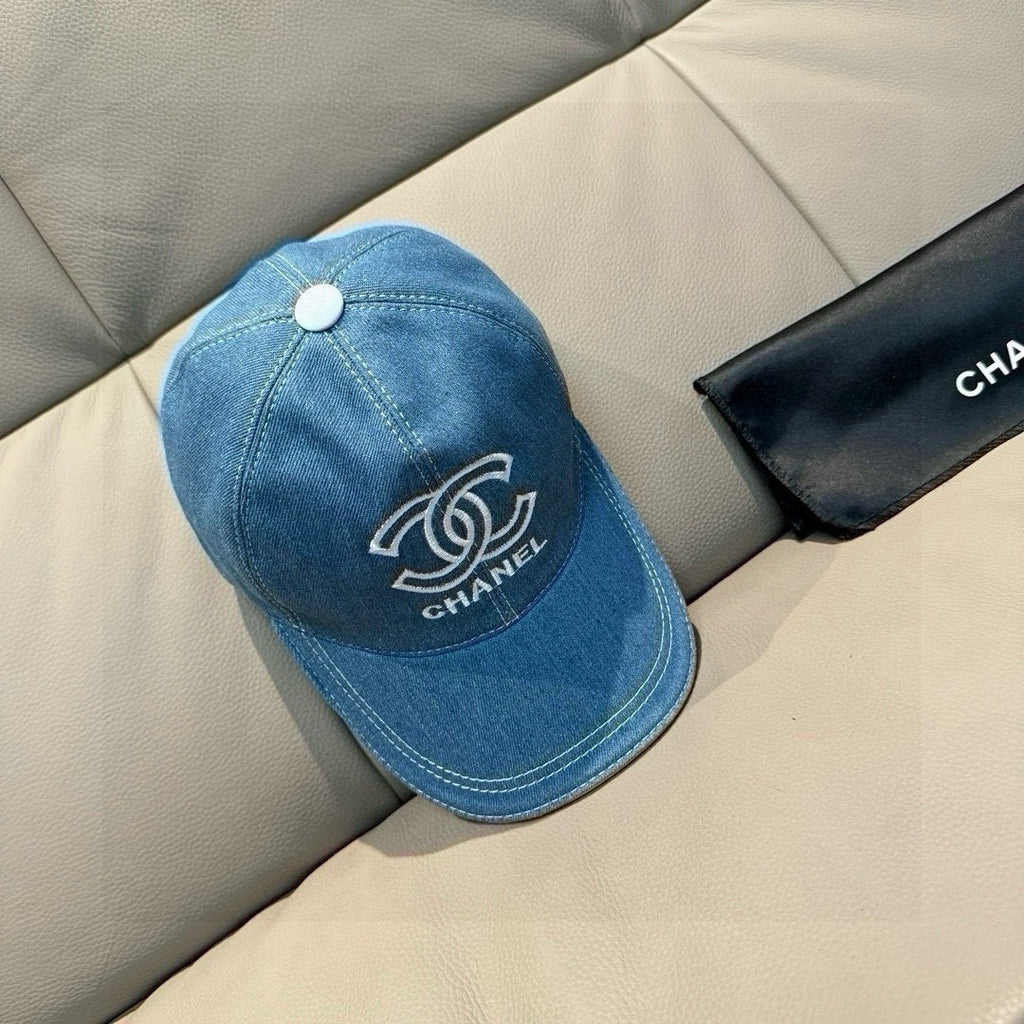 Denim baseball cap with CHANEL logo patch, light blue, top button, curved brim