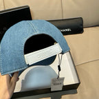 Denim cap interior with fabric brand strap and hang tag, light blue curved brim