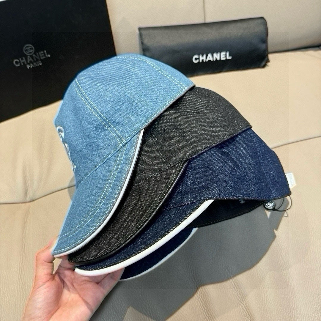 Light blue denim cap with black underside trim and curved brim