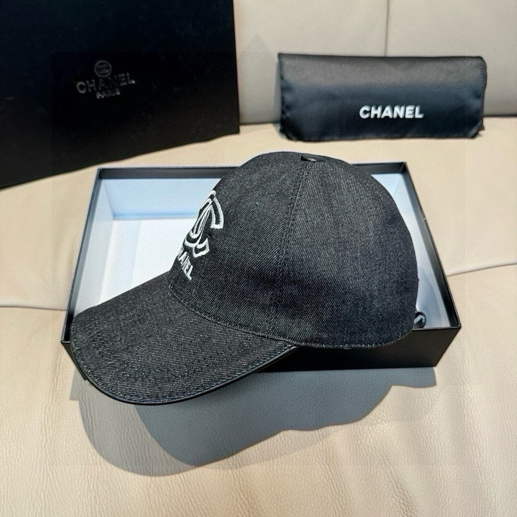 Dark charcoal denim baseball cap in box, white logo detail on front