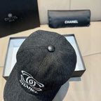 Dark charcoal denim baseball cap, side view with white embroidered logo