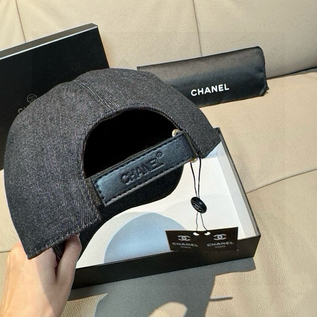 Dark denim baseball cap with inner lining visible and black strap tag