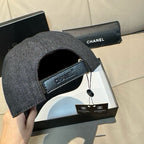 Dark denim baseball cap with inner lining visible and black strap tag