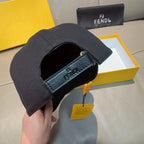 Fendi cap viewed from inside opening with dark fabric and Fendi logo patch