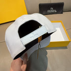 White cap with black interior and FENDI label on inner band