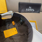 Cap interior with black lining, adjustable strap, and hanging FENDI tags