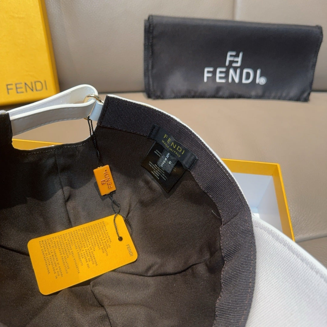 Cap interior with black lining, adjustable strap, and hanging FENDI tags
