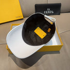 White cap with black interior lining and hanging yellow tags