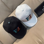 Fendi caps set: black cap and white cap, each with multicolor logo embroidery