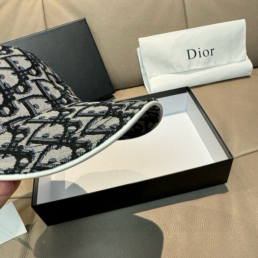 Dior cap side profile with black-and-white monogram pattern and wide brim