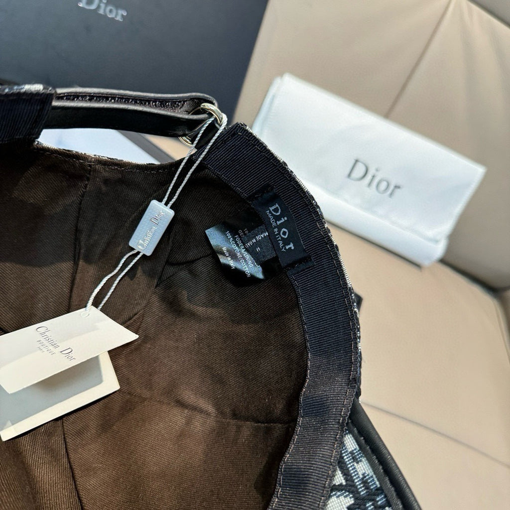 Dior cap strap area with hanging tags and woven trim along the edge