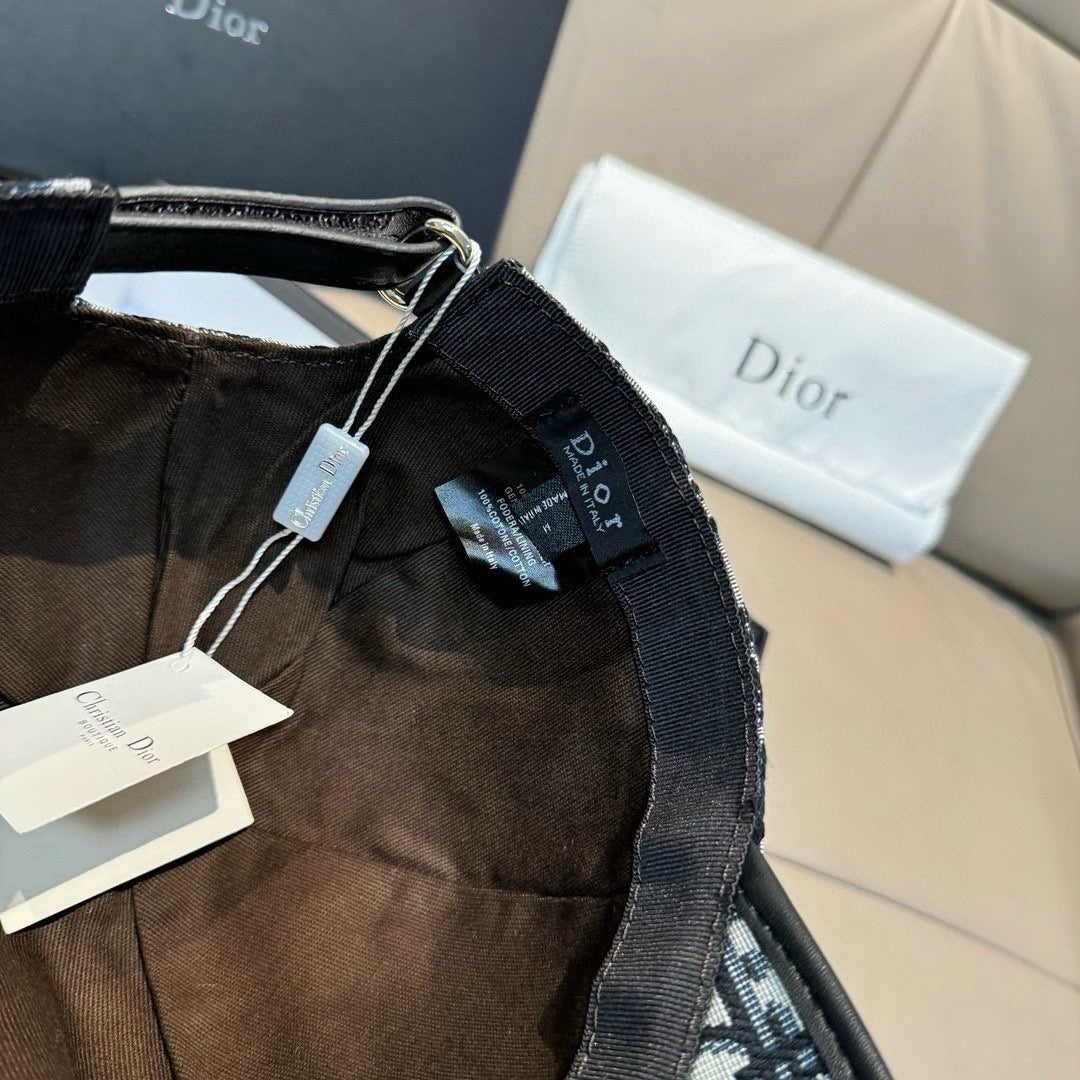 Dior cap strap area with hanging tags and woven trim along the edge