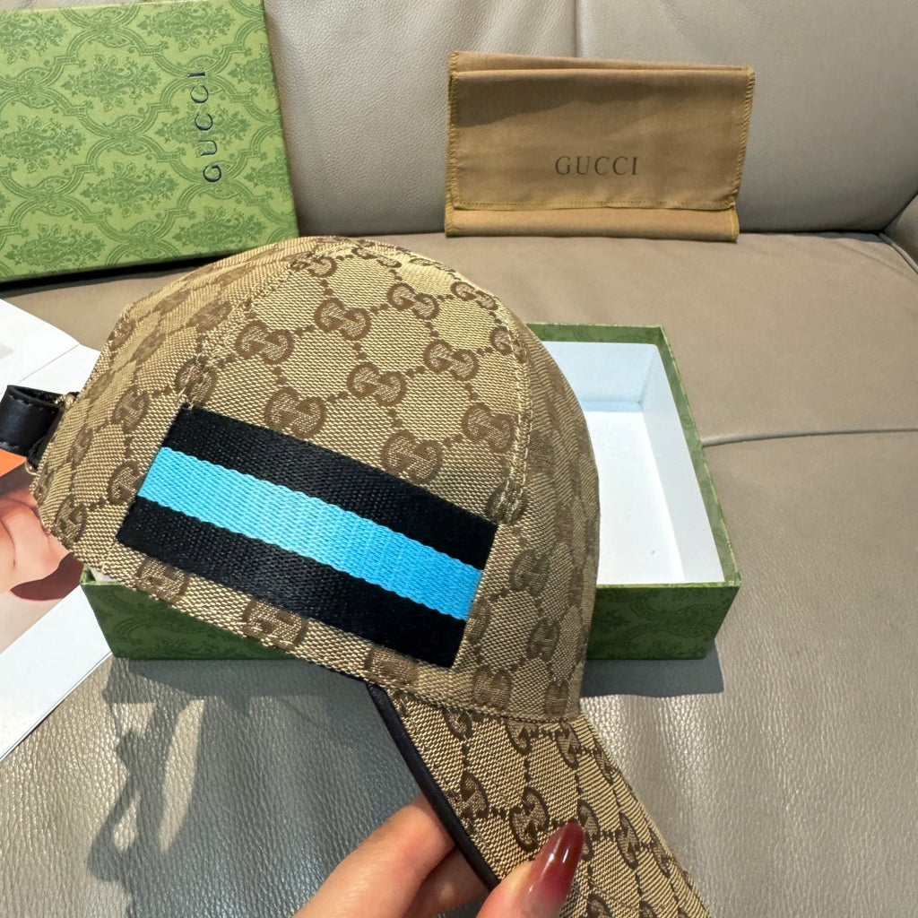 Gucci baseball cap with GG monogram print and blue/black stripe detail