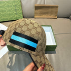 Gucci baseball cap with GG monogram print and blue/black stripe detail
