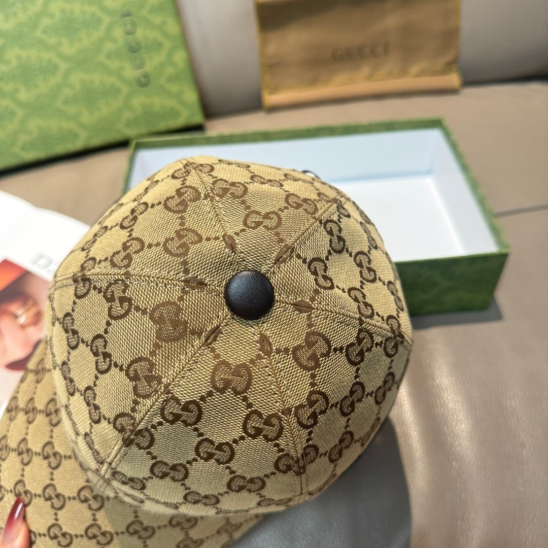 Gucci baseball cap top view with GG monogram fabric and round button