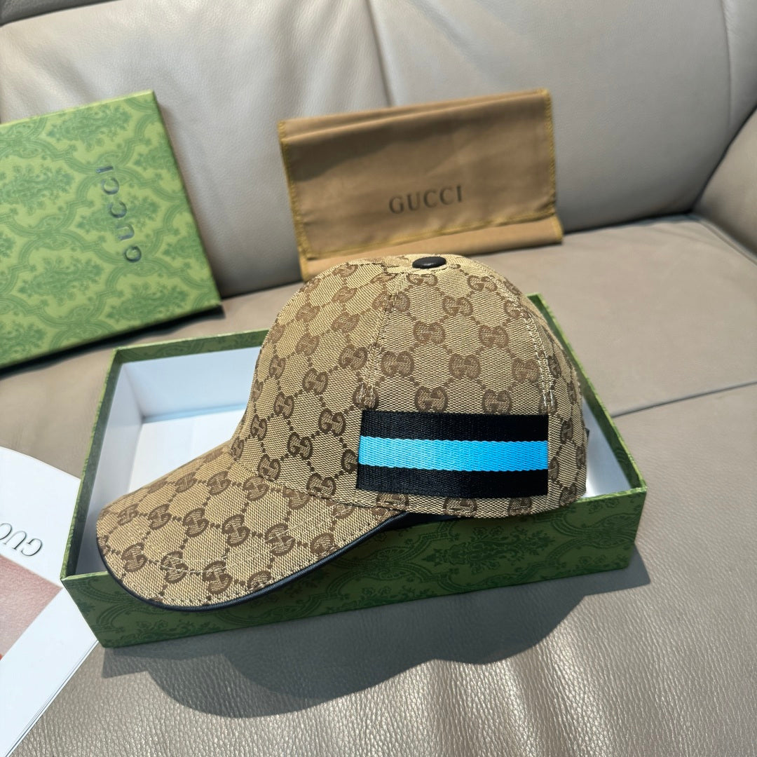Gucci baseball cap with GG monogram print and blue/black stripe front