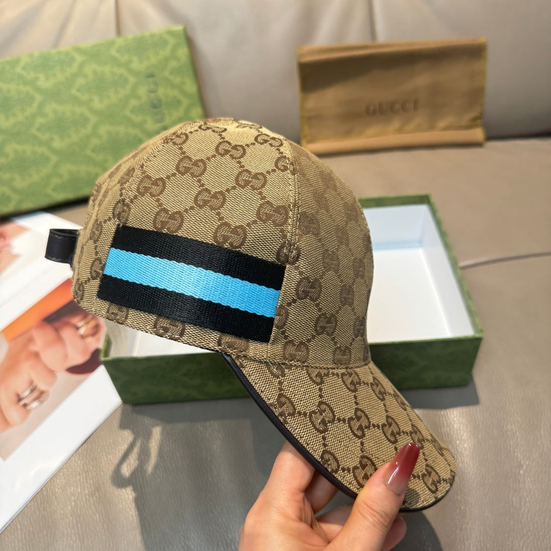 Gucci baseball cap close-up: GG monogram with blue/black stripe front panel