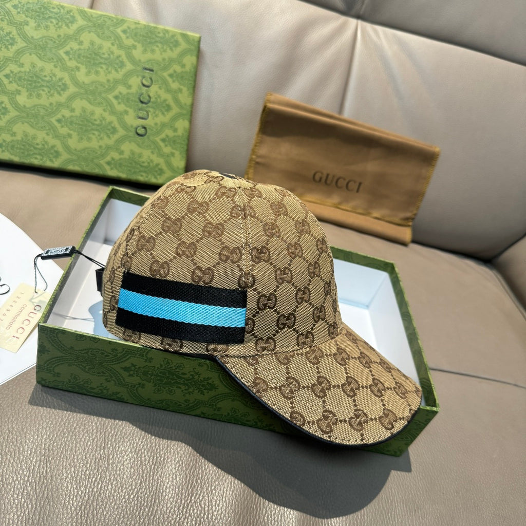 Gucci baseball cap with GG monogram print and blue/black stripe across crown