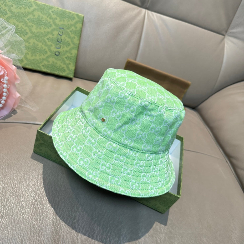 Gucci green monogram bucket hat with wide brim and stitched eyelets