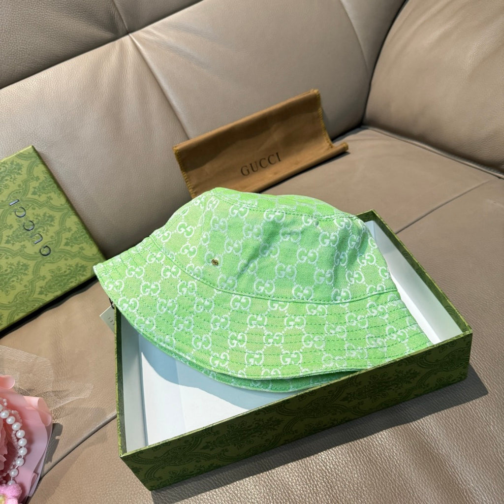 Gucci green monogram bucket hat folded in its box, wide brim