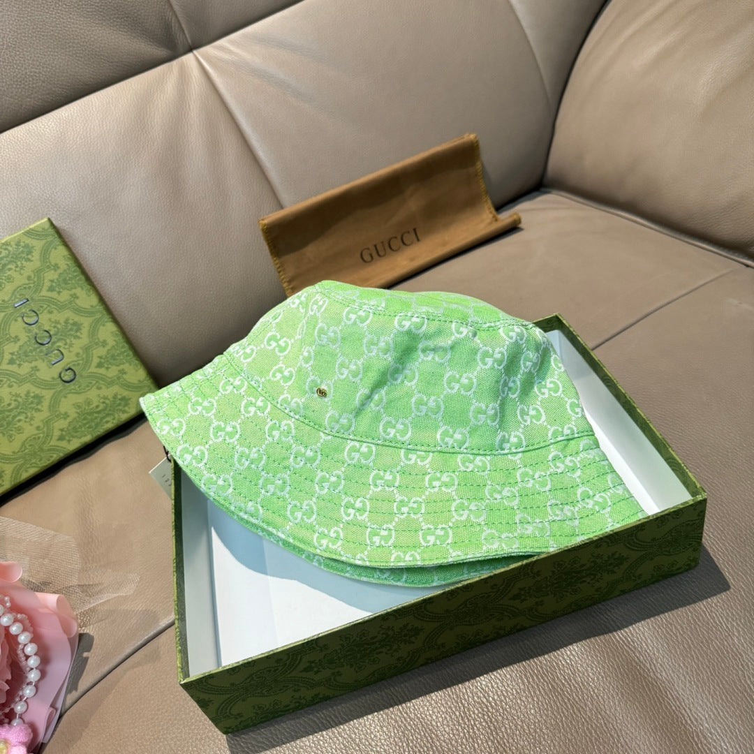 Gucci green monogram bucket hat folded in its box, wide brim