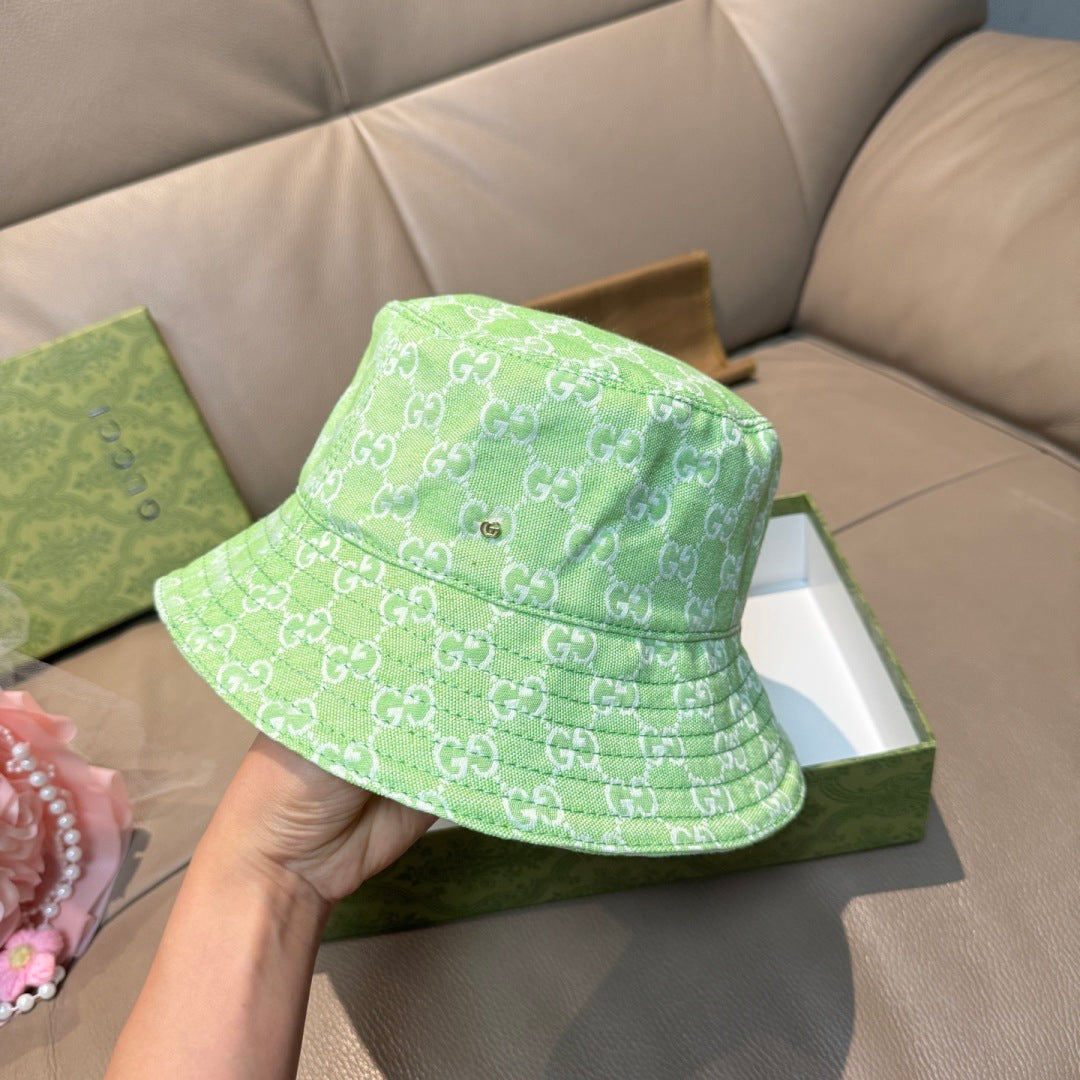 Gucci green monogram bucket hat, three-quarter view, wide brim