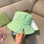 Gucci green monogram bucket hat, front view, wide brim