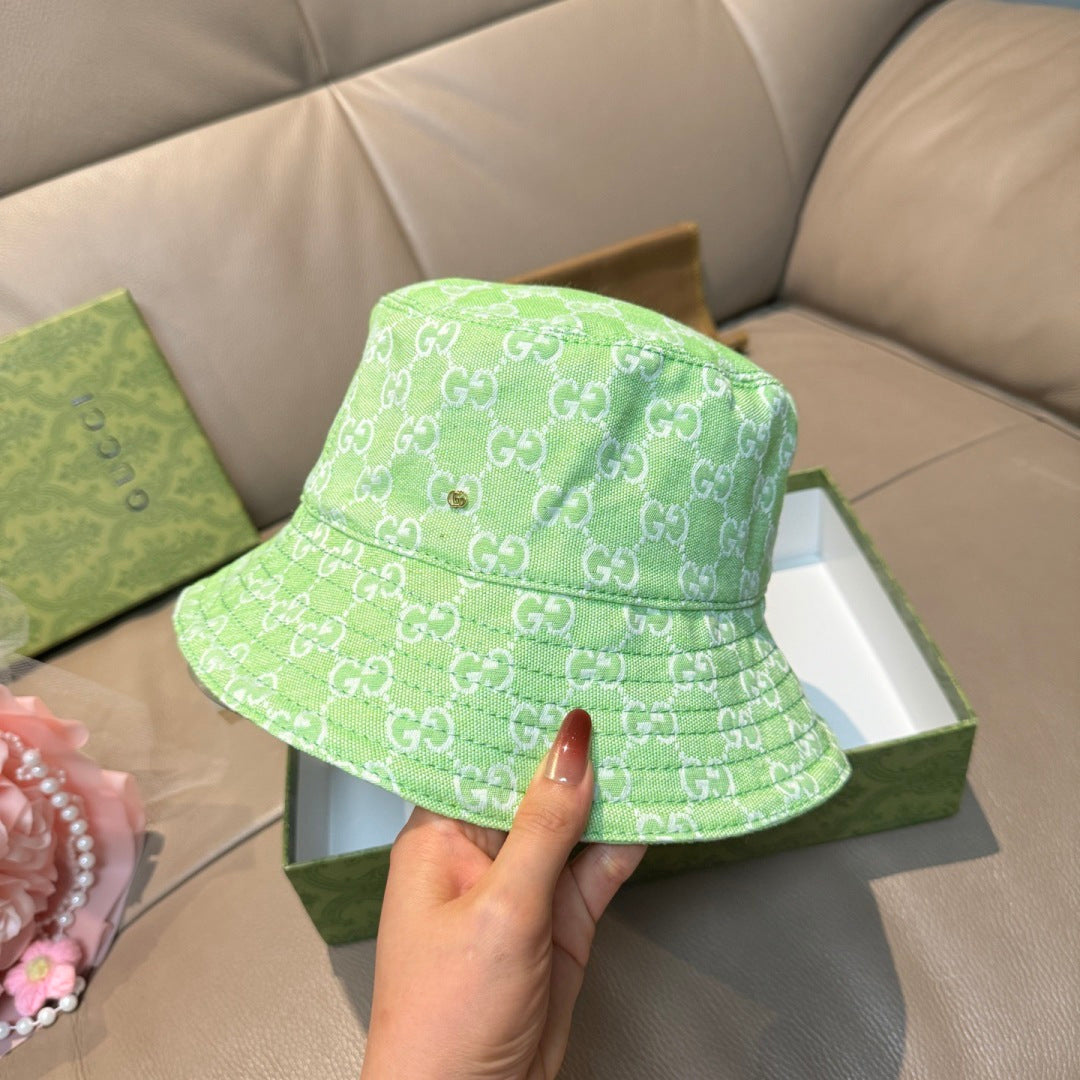Gucci green monogram bucket hat, front view, wide brim