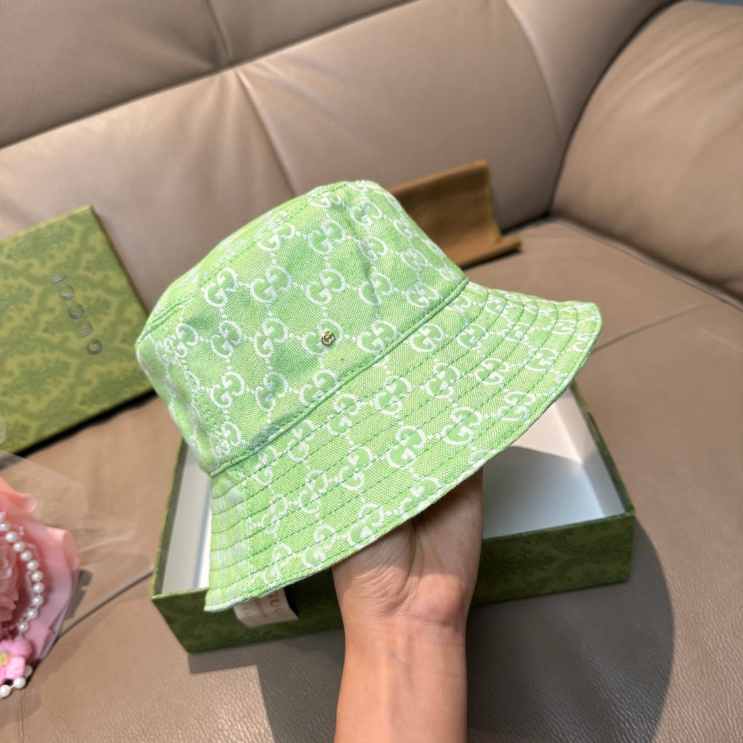 Gucci green monogram bucket hat with side profile and wide brim