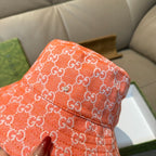 Gucci orange GG monogram bucket hat close-up