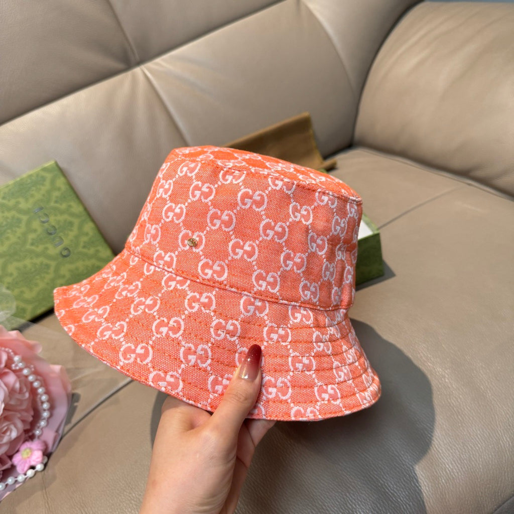Gucci orange GG monogram bucket hat, side view, wide brim