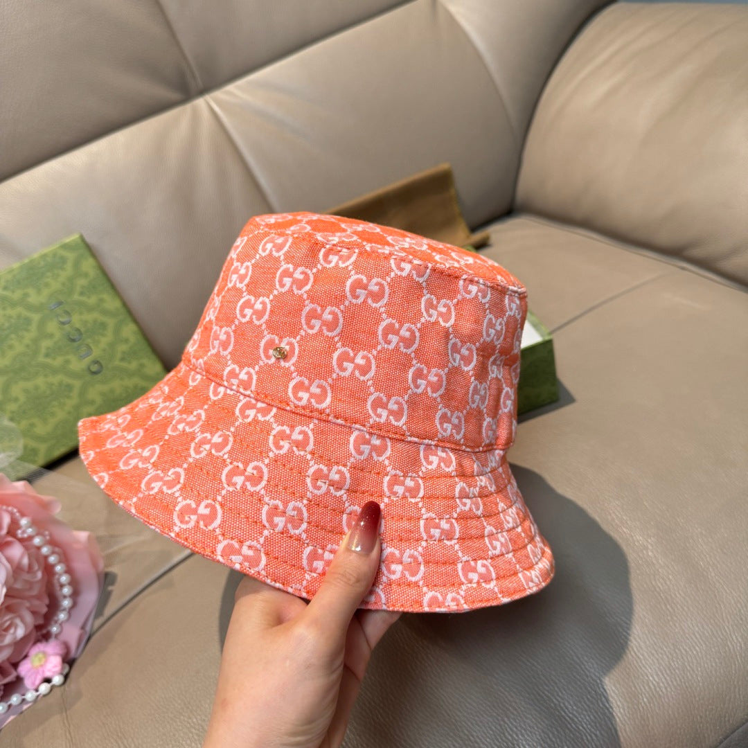 Gucci orange GG monogram bucket hat, side view, wide brim