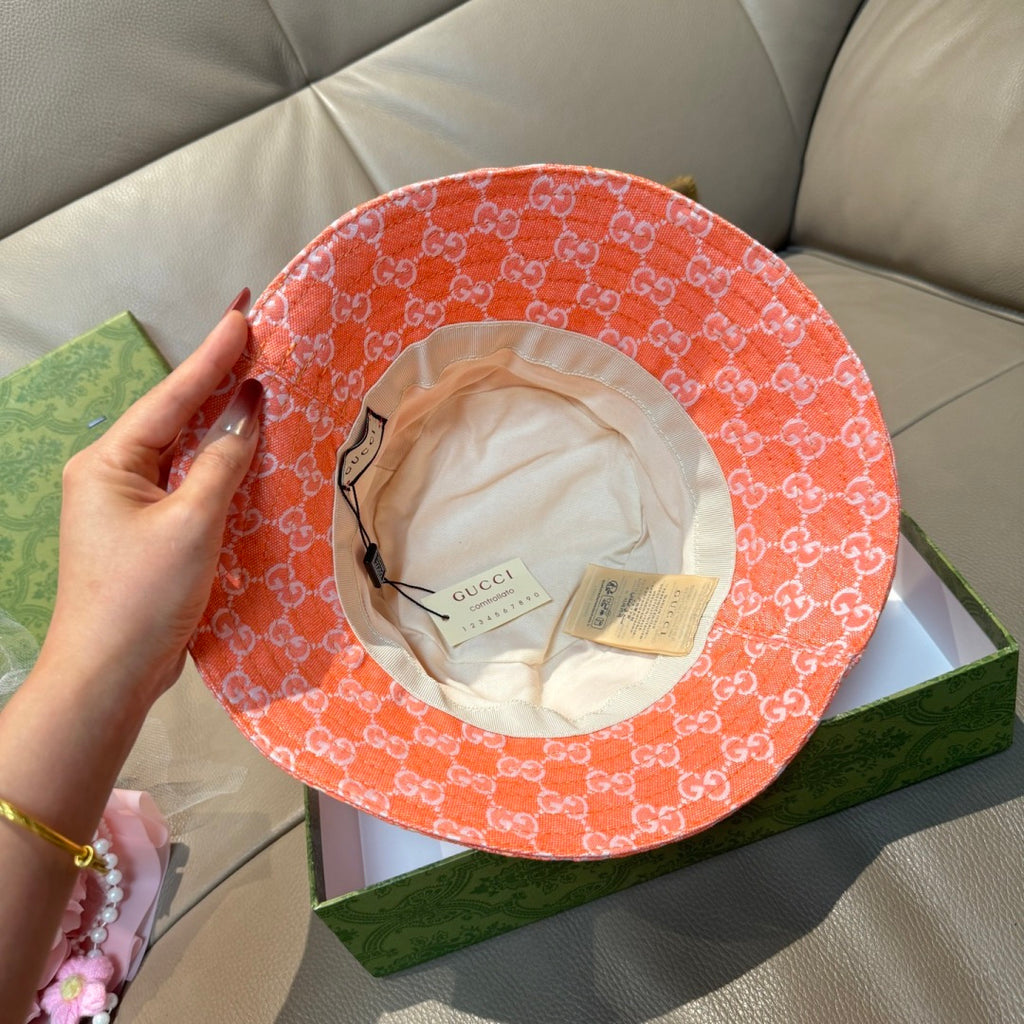 Gucci orange GG monogram bucket hat interior with brand tag