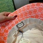 Gucci orange GG monogram bucket hat inside view with size label