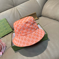 Gucci orange GG monogram bucket hat with wide brim