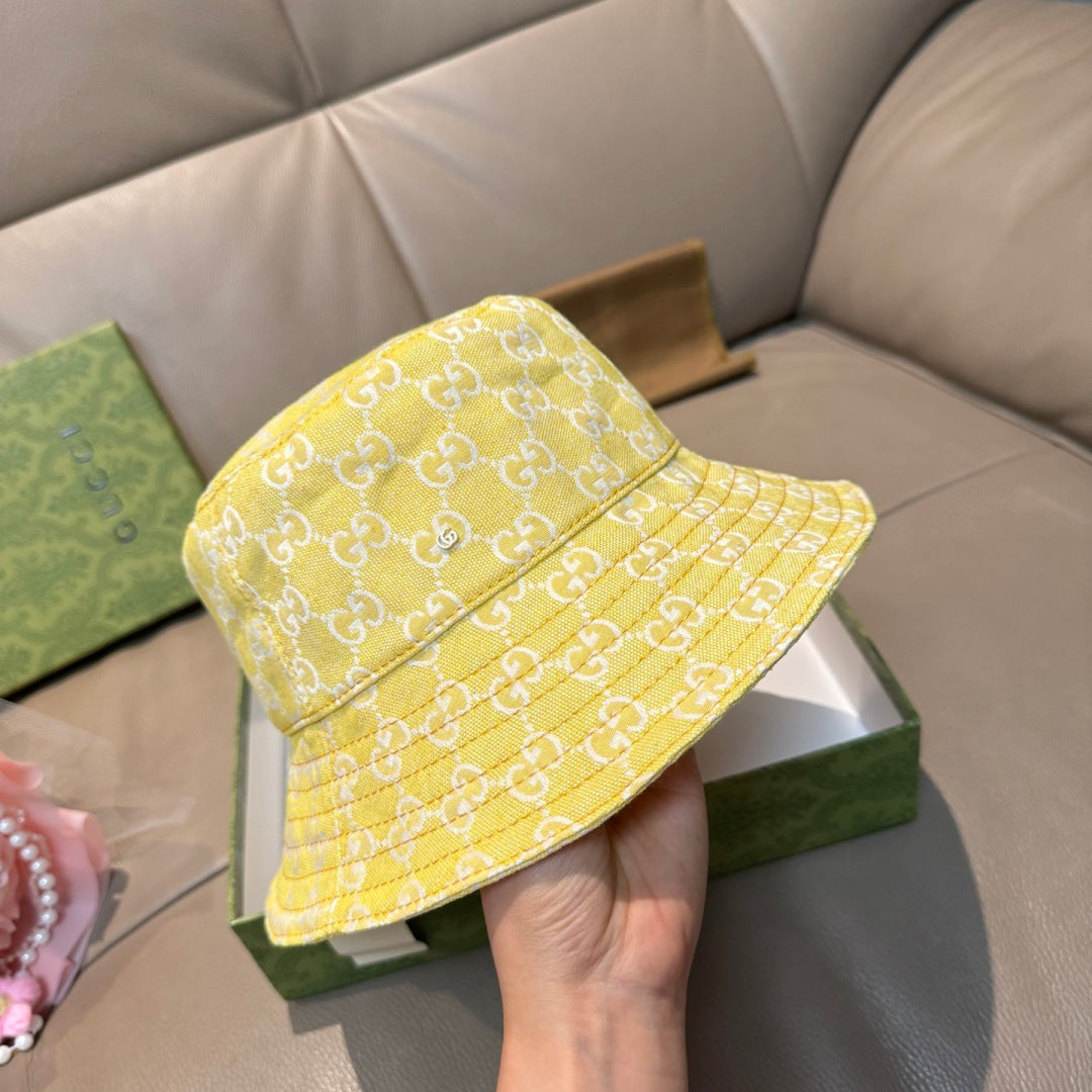 Gucci yellow monogram bucket hat, front view with stitched seam and brim