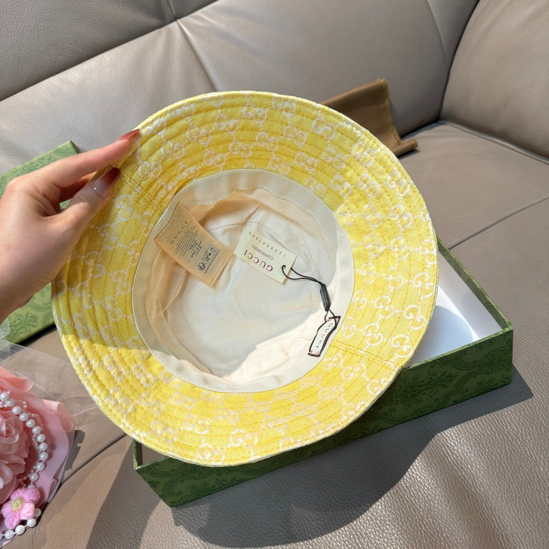 Gucci yellow monogram bucket hat with interior lining and size label