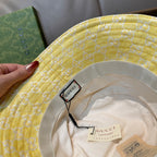 Gucci yellow monogram bucket hat interior with Gucci label and brim trim