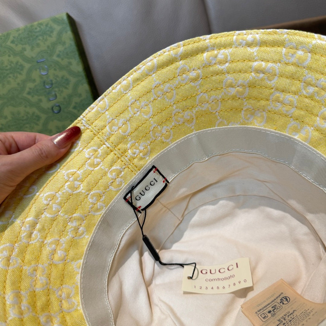 Gucci yellow monogram bucket hat interior with Gucci label and brim trim