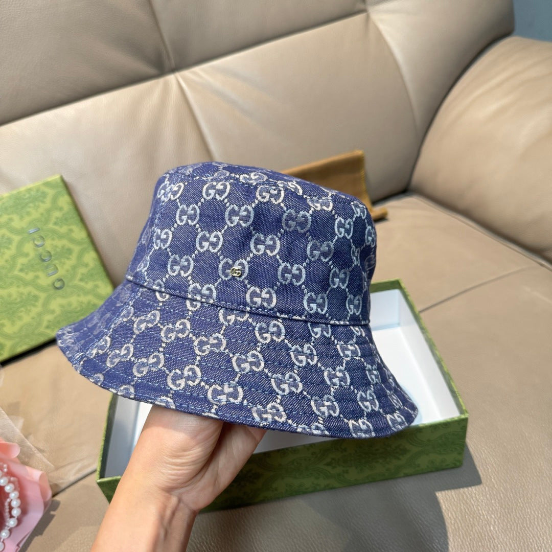 Gucci bucket hat in blue GG monogram denim, angled front view