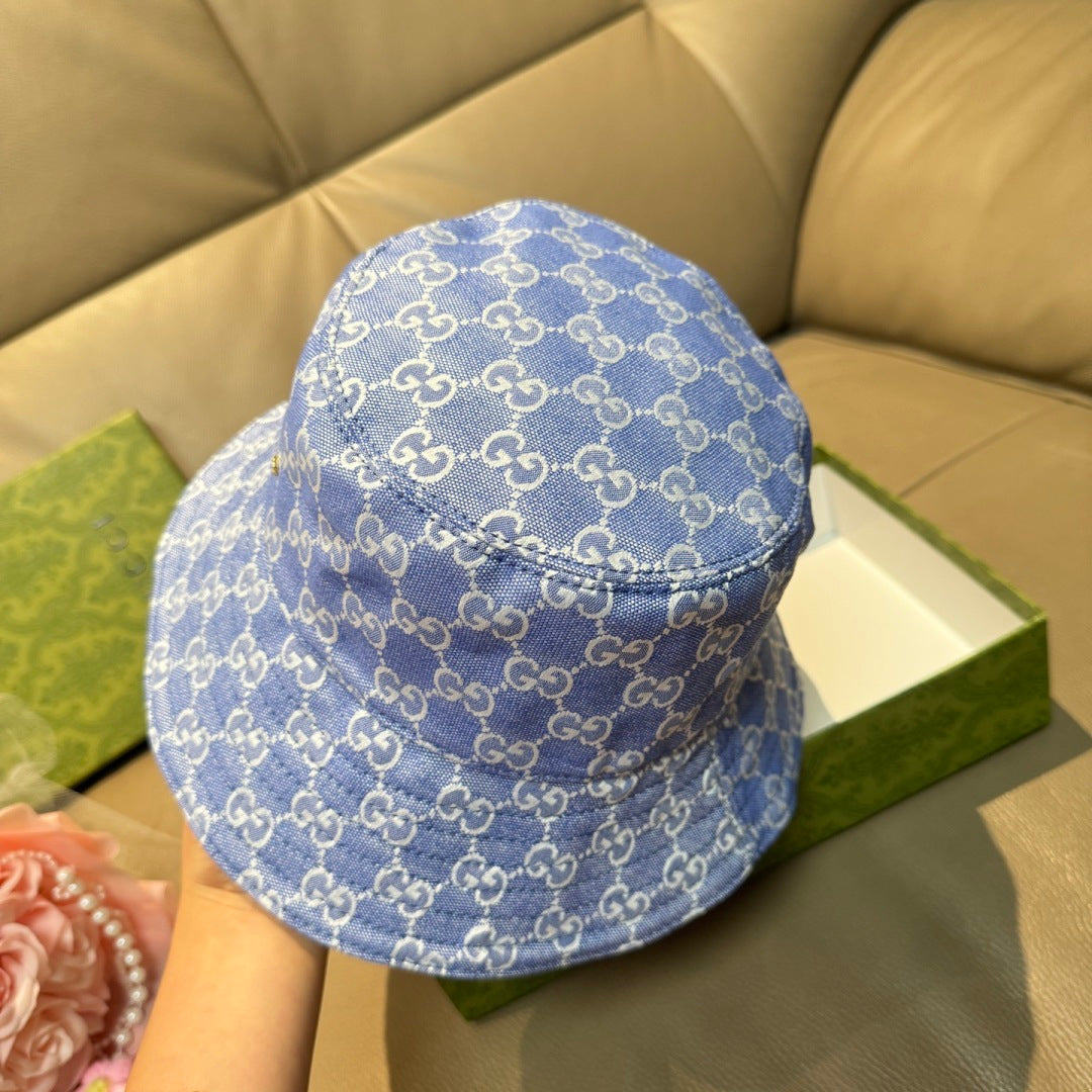 Gucci bucket hat in blue with allover GG monogram print and curved brim