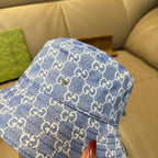 Gucci blue bucket hat close-up with GG monogram fabric and stitched front panel