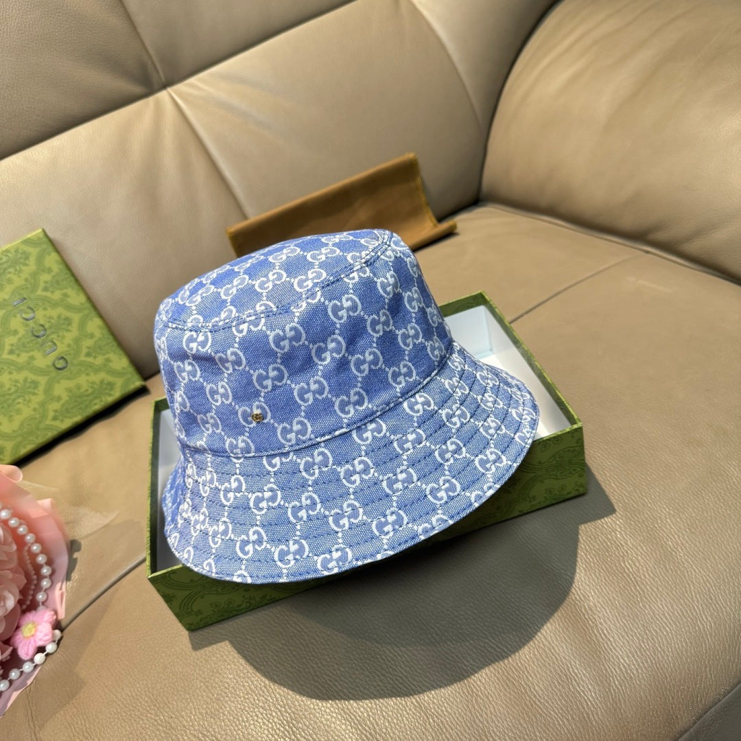 Gucci bucket hat in blue with allover GG monogram print and stitched brim edge